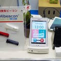 機器構成は通信用のSIMを内蔵したタブレット、各種センサーを搭載した専用クレードル「見守りステーション」、流水センサーとなる。家族は遠隔地から安否確認や、生活リズムを可視化したグラフなどを確認することができる（撮影：防犯システム取材班）